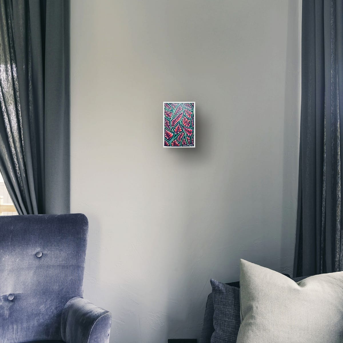Decorative wall art piece of an A6 original acrylic painting featuring a vibrant floral bloom pattern with red blossoms and green botanical lines by Eman Khalifa, on a gray wall with a blue armchair and gray curtains.