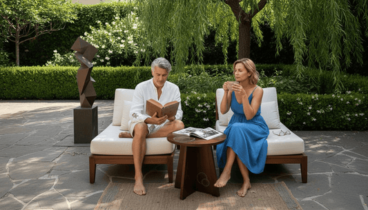 Couple relaxing beside outdoor sculpture