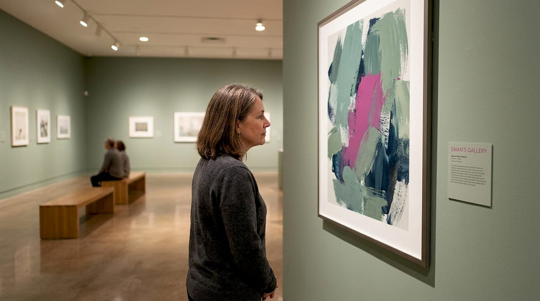 Visitor observing colorful abstract print in gallery