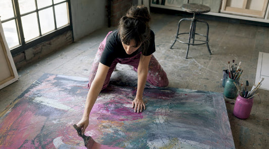 Artist painting colorful abstract canvas