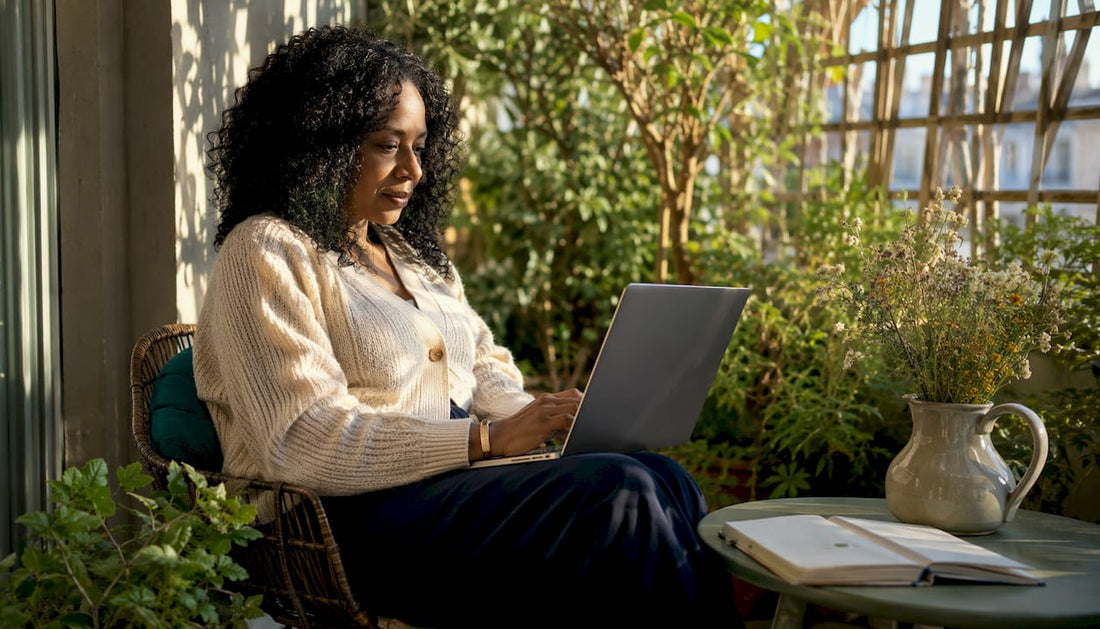 Woman browsing art prints on tablet