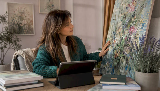 Collector examining traditional and digital art side by side