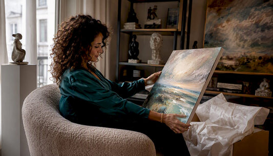 Woman examining canvas print in living room