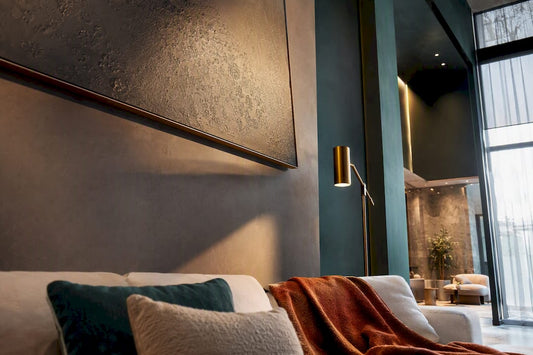 Oversized metal wall art casting shadows