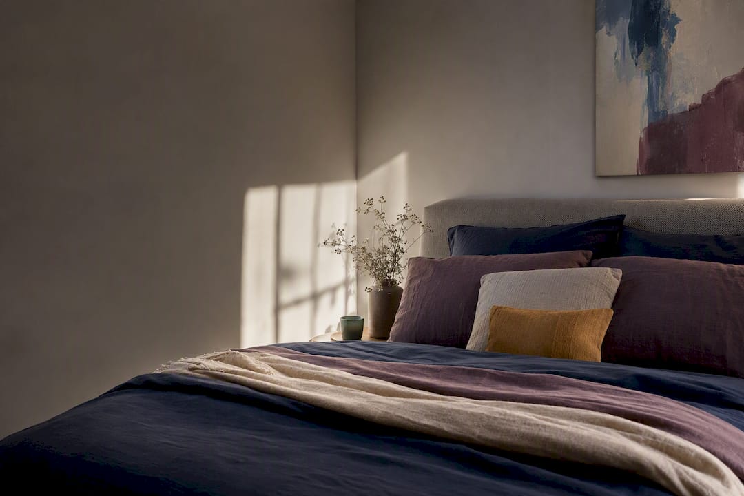 Bedroom palette anchored by cropped artwork