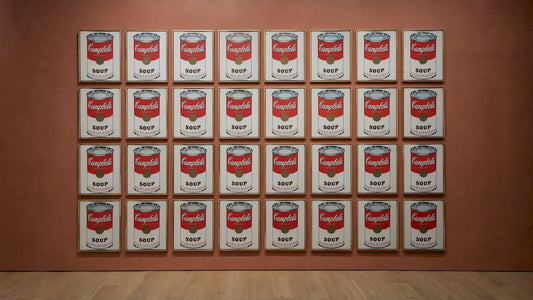 Warhol’s repeated soup-can paintings in a gallery
