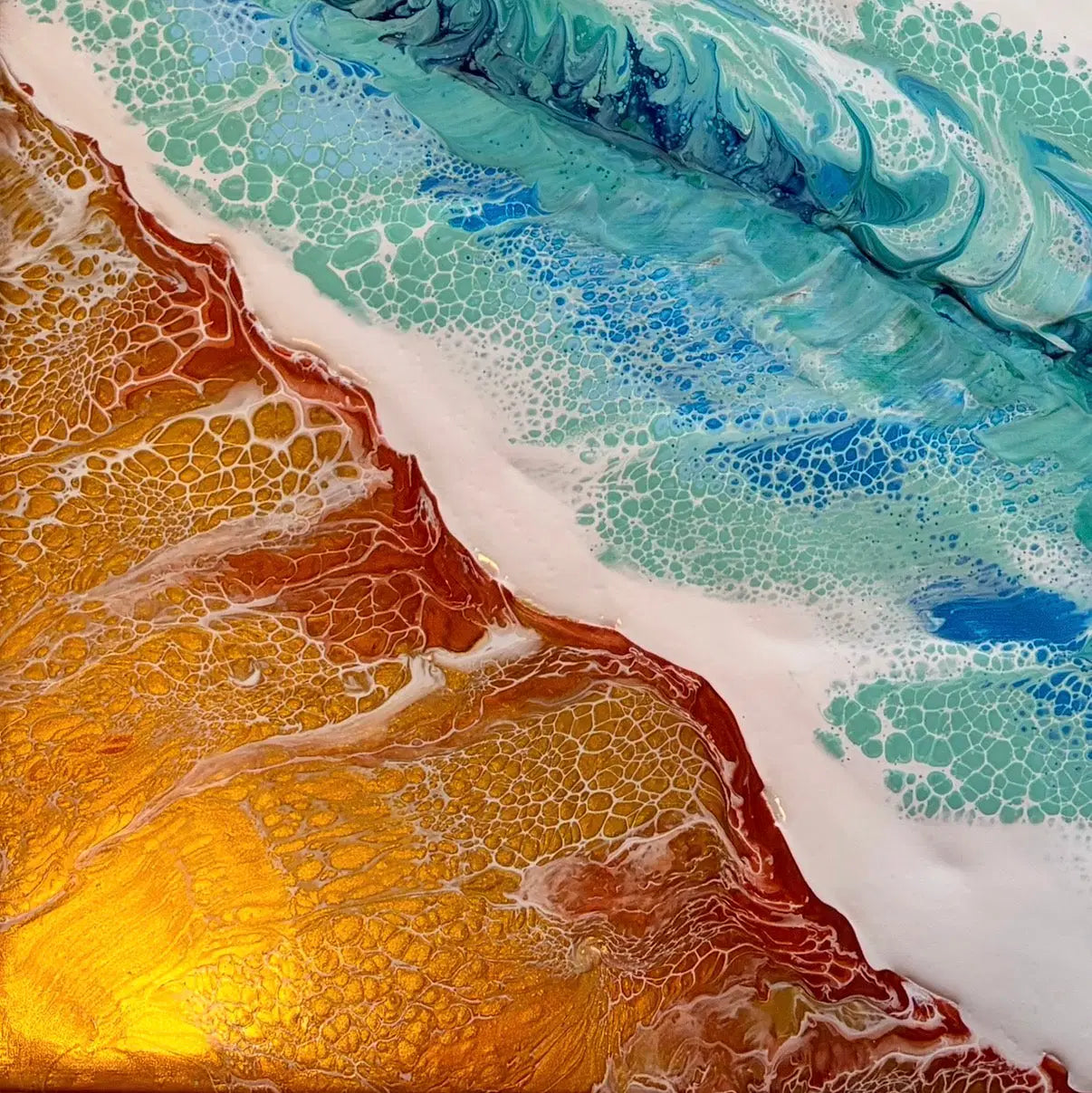Close-up of a textured surface with blue, gold, copper, and white colors.