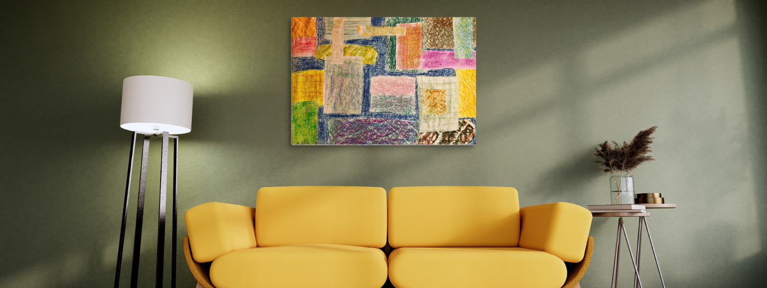 Abstract patchwork painting in vibrant yellow, blue, and pink colors displayed above a yellow sofa in a modern living room