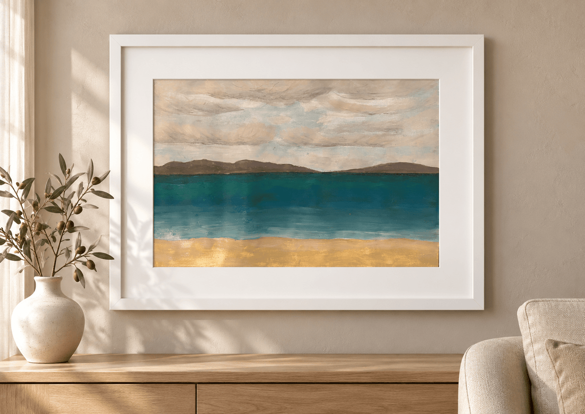 Solace by Eman Khalifa, a tranquil teal sea beneath a soft grey sky, with distant brown land and a warm sandy foreground, framed above an oak console with a white vase