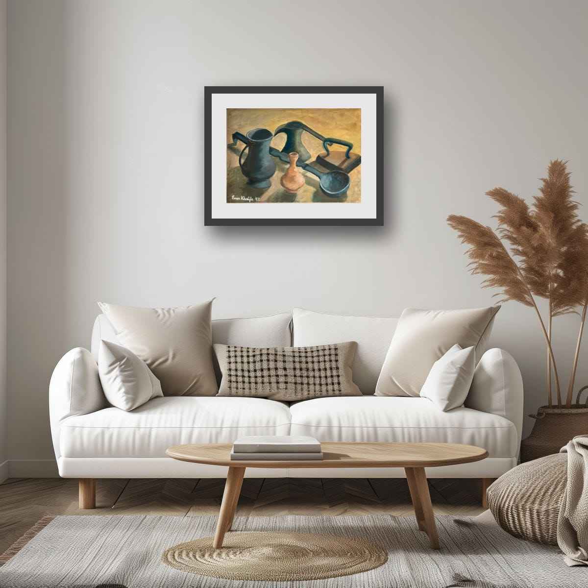 Living room with a white sofa, wooden coffee table, and framed artwork on the wall.