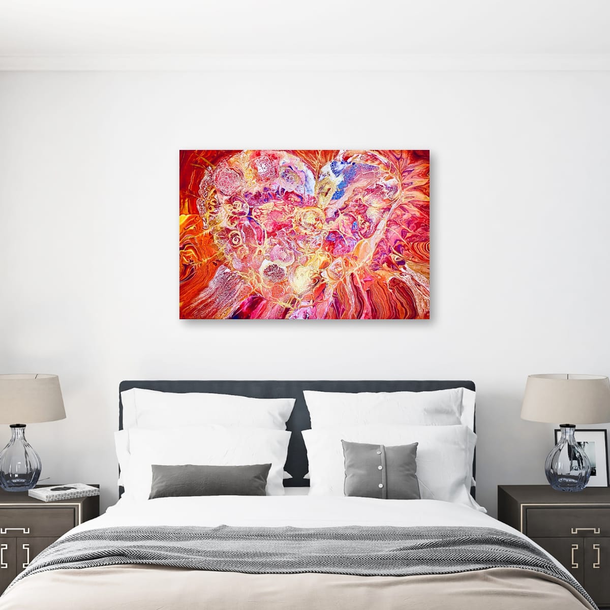 Orgasm by Eman Khalifa, a red and pink abstract painting with a luminous white and gold heart-like burst and flowing violet details above a bed with two side tables