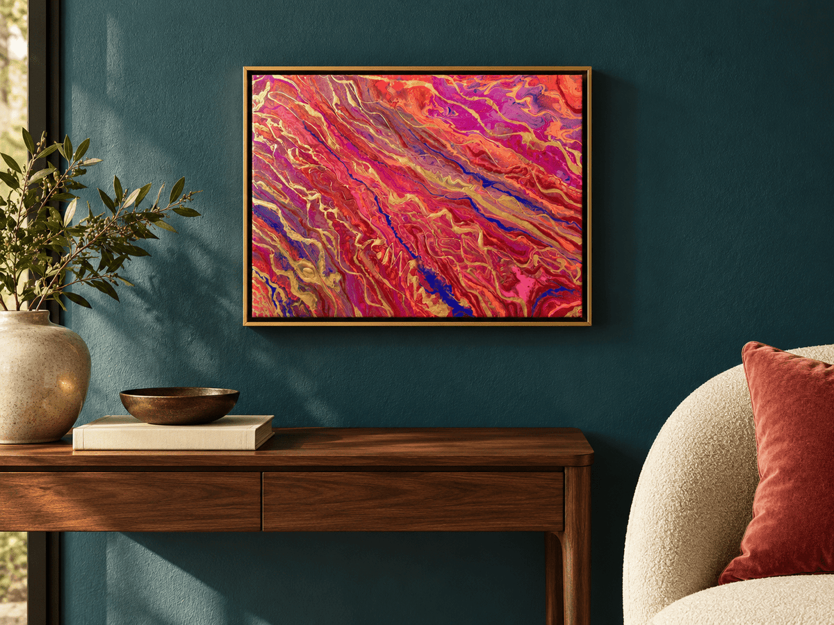 Passion by Eman Khalifa, an abstract painting of diagonal magenta, red and orange currents threaded with purple and gold lines hung over a walnut console