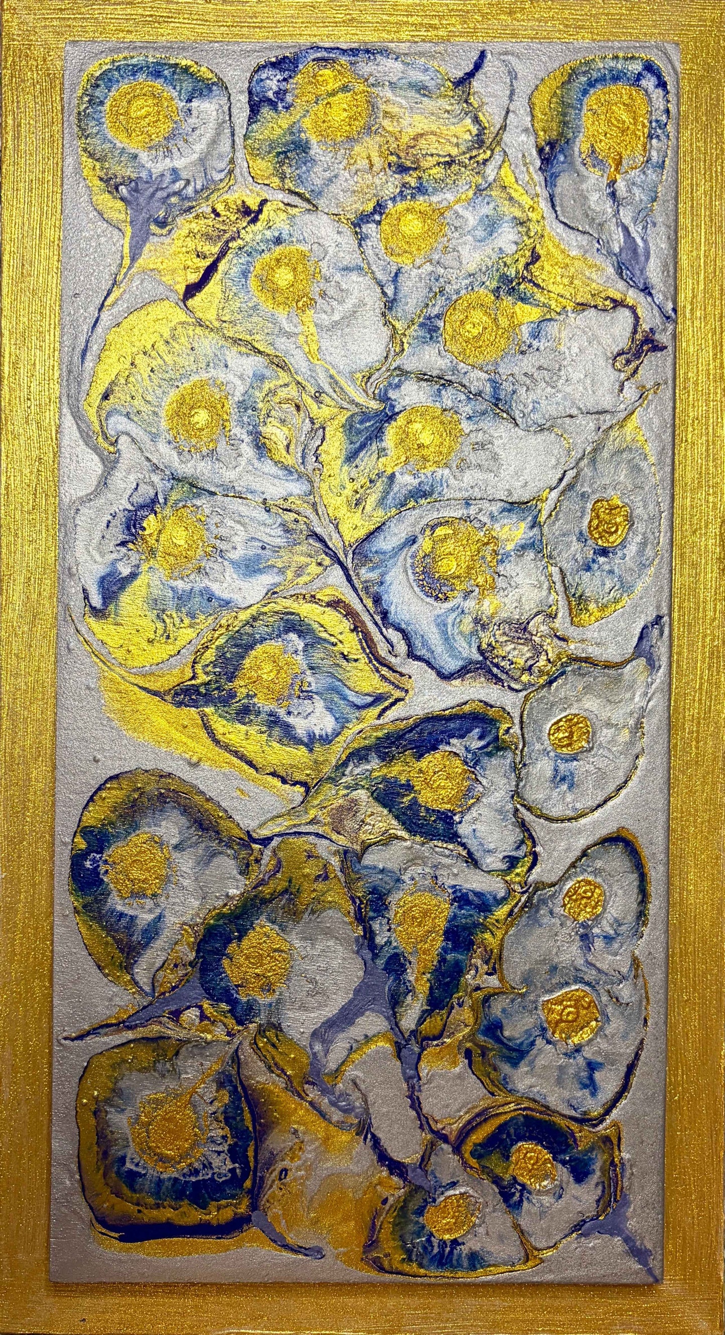 Abstract artwork with blue, yellow, gold and silver colors on a wooden frame.