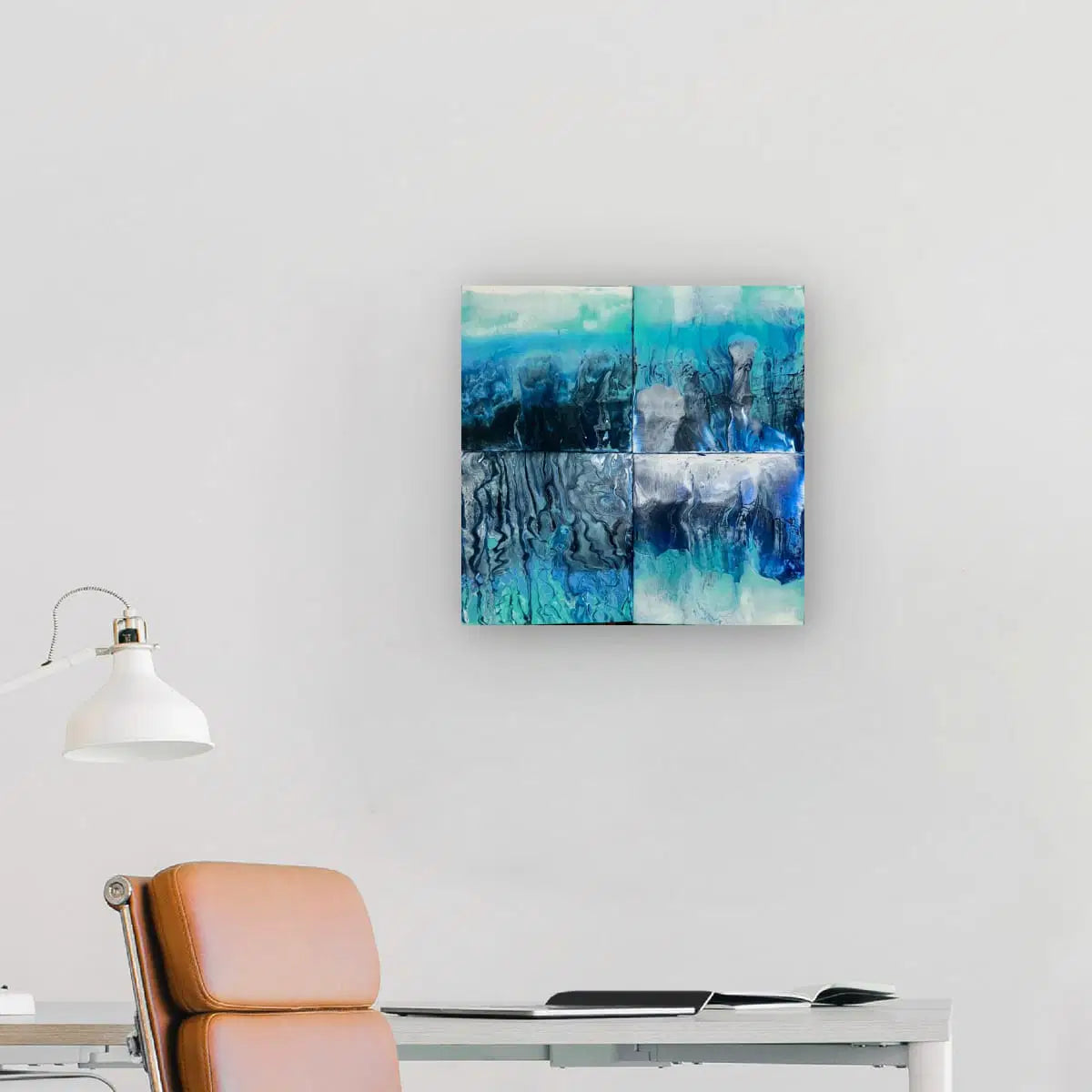 Abstract artwork in a modern office setting with a chair and desk.